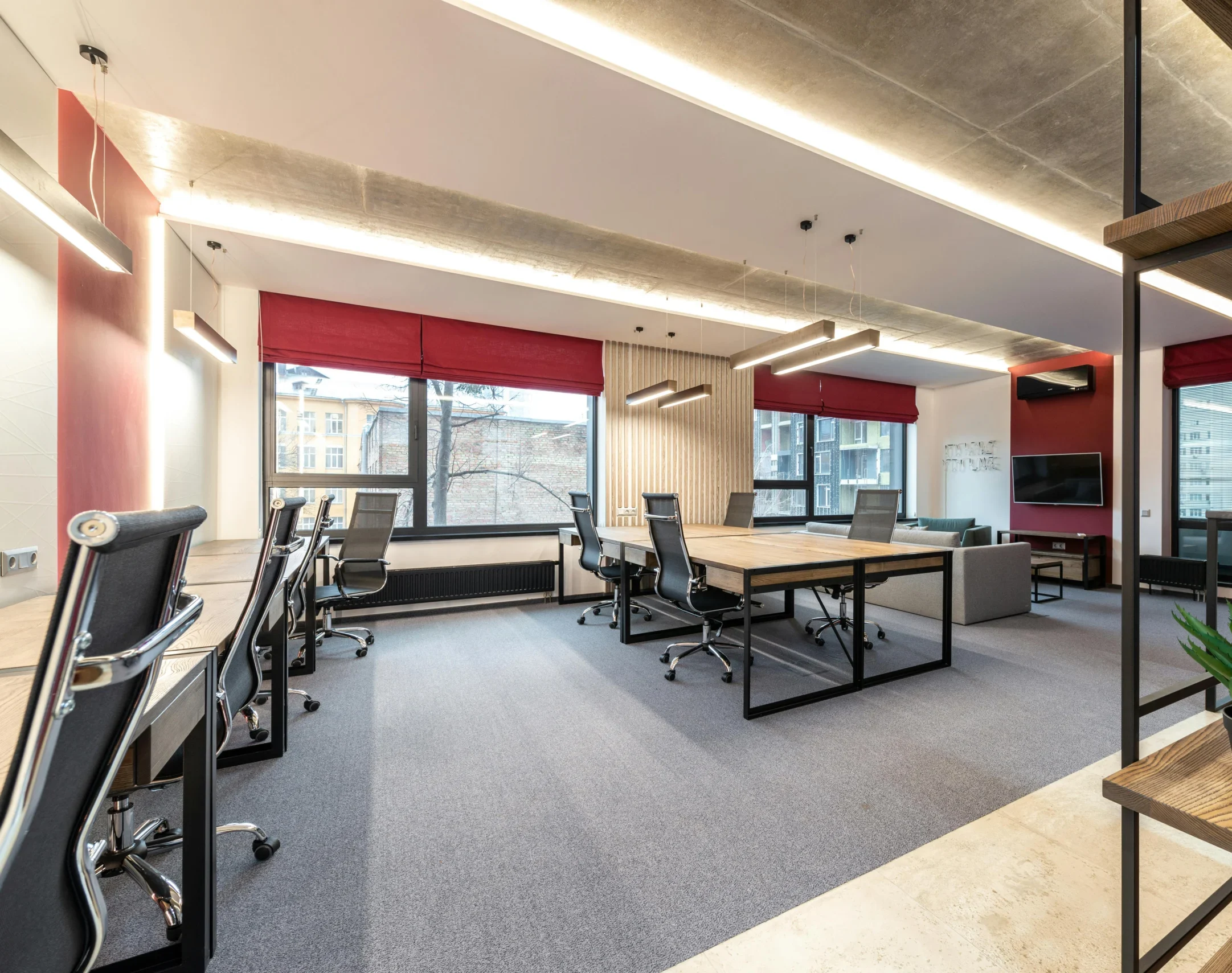 pexels-photo-6899395-6899395 Spacious and contemporary office interior with natural lighting and minimal decor.