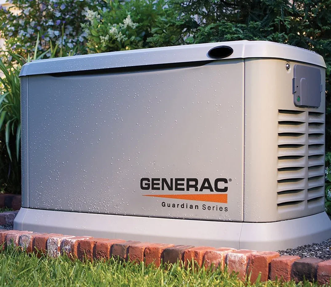 A Generac generator surrounded by bricks
